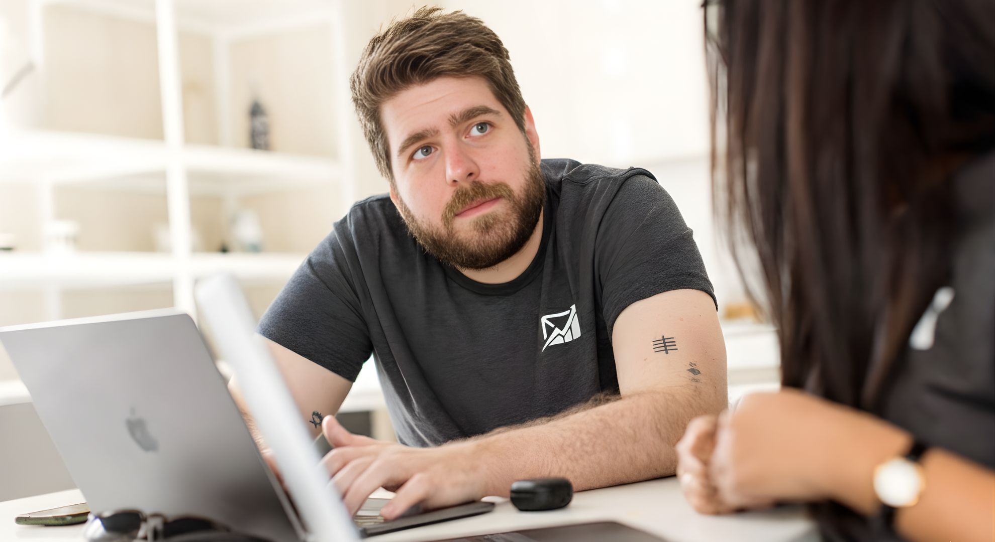 A group of diverse creative professionals brainstorming around a table